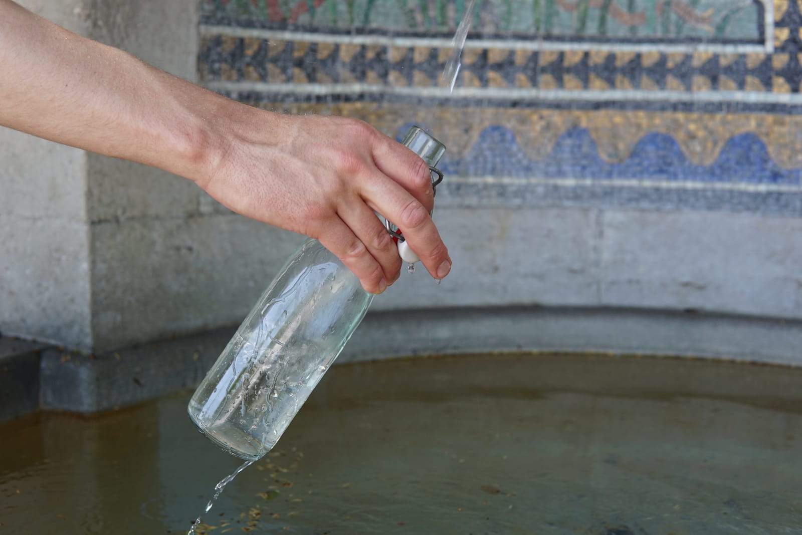 Glass bottle being filled